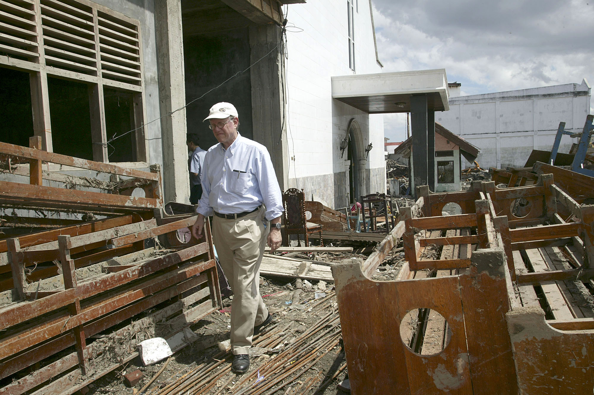 The Rev. Paul Dirdak, head of UMCOR, surveys the damage to the Methodist Church in Banda Aceh. A UMNS photo by Mike DuBose.