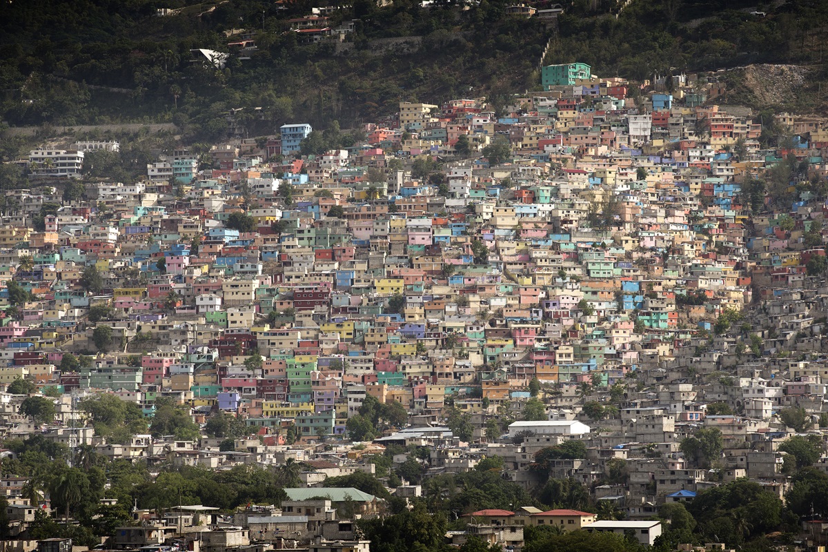 Pastel-colored homes in the Jalousie neighborhood line a hill overlooking Port-au-Prince, Haiti. Photo by Mike DuBose, UMNS