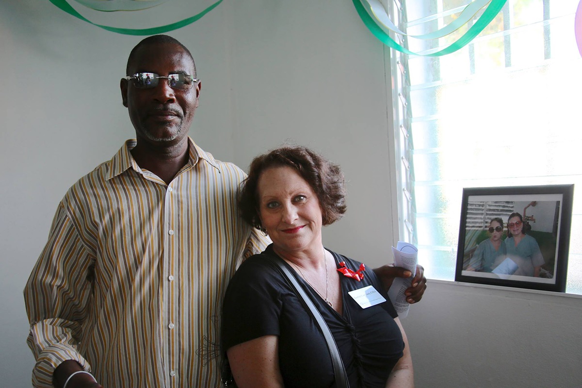 Karen Gardner (left) was among the Highland Park United Methodist Church volunteers injured in Petit-Goâve, Haiti during the 2010 earthquake. She returned in January 2014 for the dedication of the church’s new eye clinic building and posed with Ruben, a Haitian man who helped rescue her. File photo courtesy of Highland Park United Methodist Church