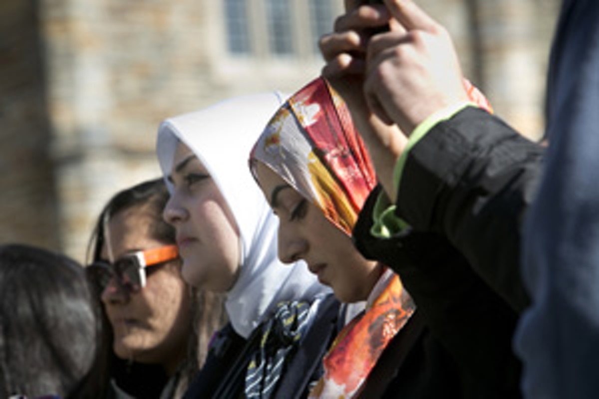 Muslim students at Duke University have used the basement of Duke Chapel for years for prayer services. They gathered outside the chapel on January 16, 2015, for the adhan, or call to prayer. Duke first agreed to let the students do the adhan from the chapel bell tower, but reversed the decision. Photo by Megan Morr, © Duke Photography
