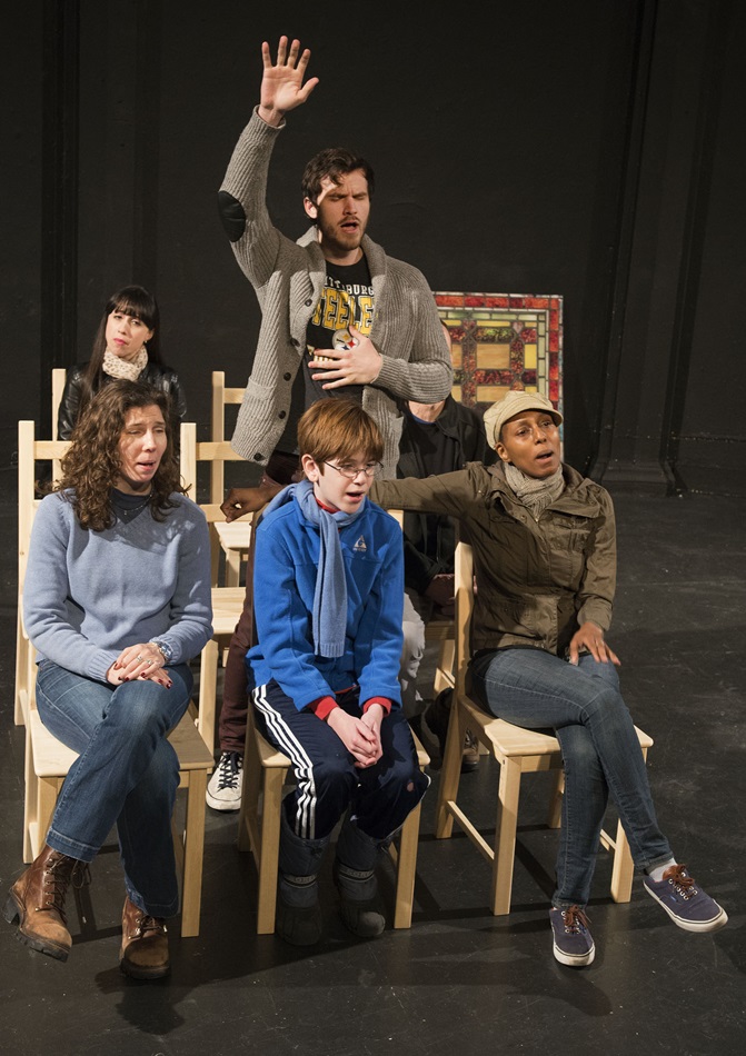 The first scene of the play “Church of Why Not” shows singers at a service at The United Methodist Church of St. Paul and St. Andrew. A character called Paul, played by Trevor St. John-Gilbert, raises his hand as he sings. Photo © Joel Weber
