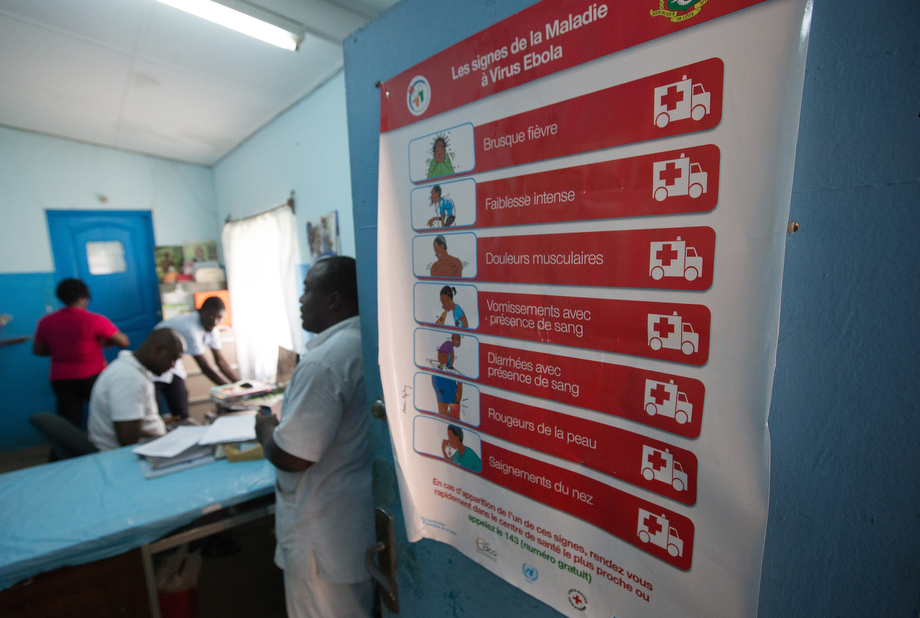A poster detailing the signs of Ebola is taped to a door at Dabou Methodist Hospital in Dabou, hub of the church's healthcare system in this West African nation. 