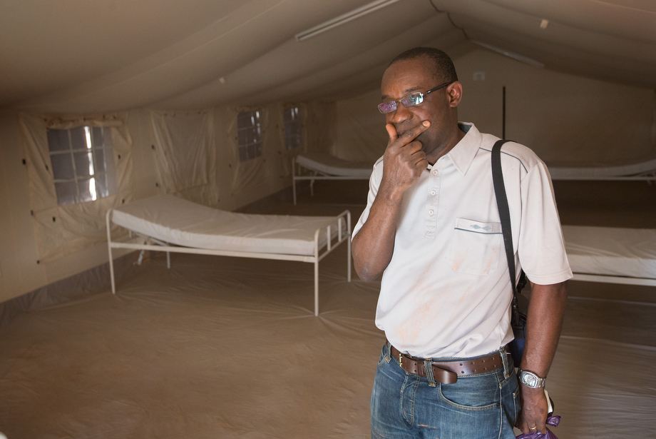 Dr. Simplice Adouko knows the threat of an Ebola outbreak is real in the border area between Côte d'Ivoire, Guinea and Liberia. Adouko, who normally works with HIV-AIDS patients, is standing in a a temporary Ebola containment and treatment center in Man.