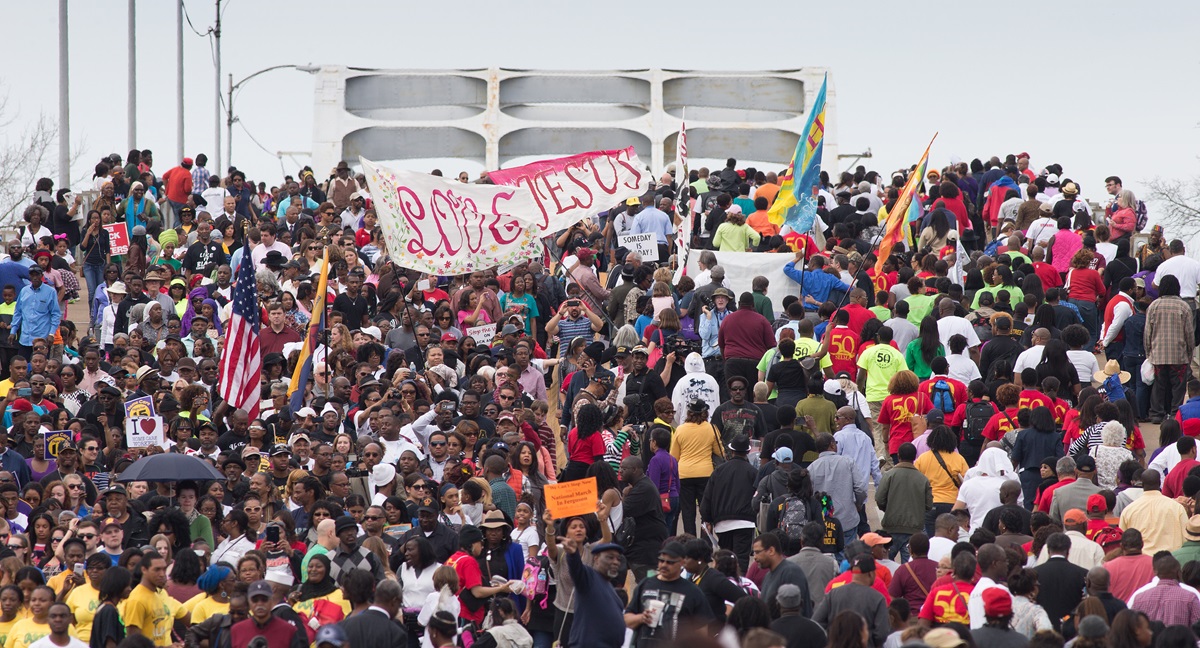 Marchers cross the Edmund Pettus Bridge in Selma, Ala., during the 50th anniversary observance of the "Bloody Sunday" protest march seeking voting rights for African Americans. Photo by Mike DuBose, UMNS