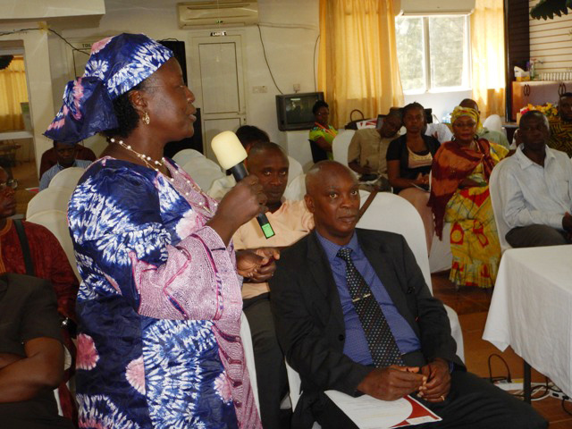The Rev. Christiana Sutton Koroma of St. Paul’s Congregational Evangelical Mission voices her opinion on the role of faith groups in post-Ebola Sierra Leone during the launch of Channels of Hope in Freetown. Photo by Phileas Jusu