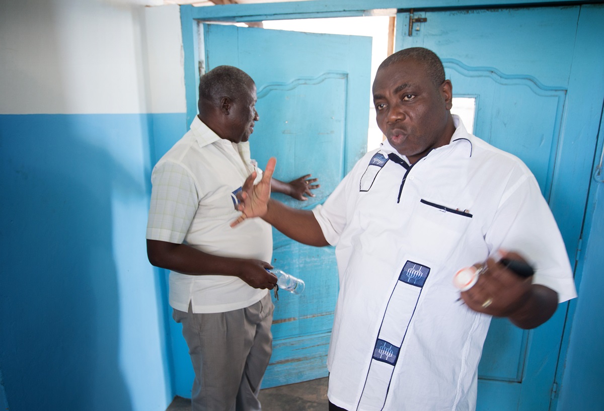 Alfred Degny (right) describes preparations to contain any possible cases of Ebola at Dabou Methodist Hospital. At left is Hyacinthe Bessé, coordinator of the health board of the United Methodist Church of Côte d'Ivoire.