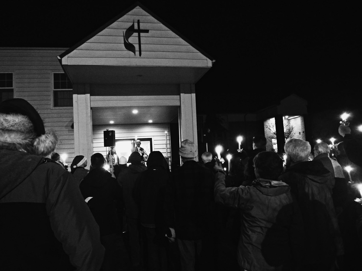 McMinnville Cooperative Ministries, a joint United Methodist-Lutheran church in McMinnville, Oregon, held a candlelight prayer vigil on Dec. 22, after learning the city was seeking to close the homeless encampment at the church. Photo courtesy McMinnville Cooperative Ministries  