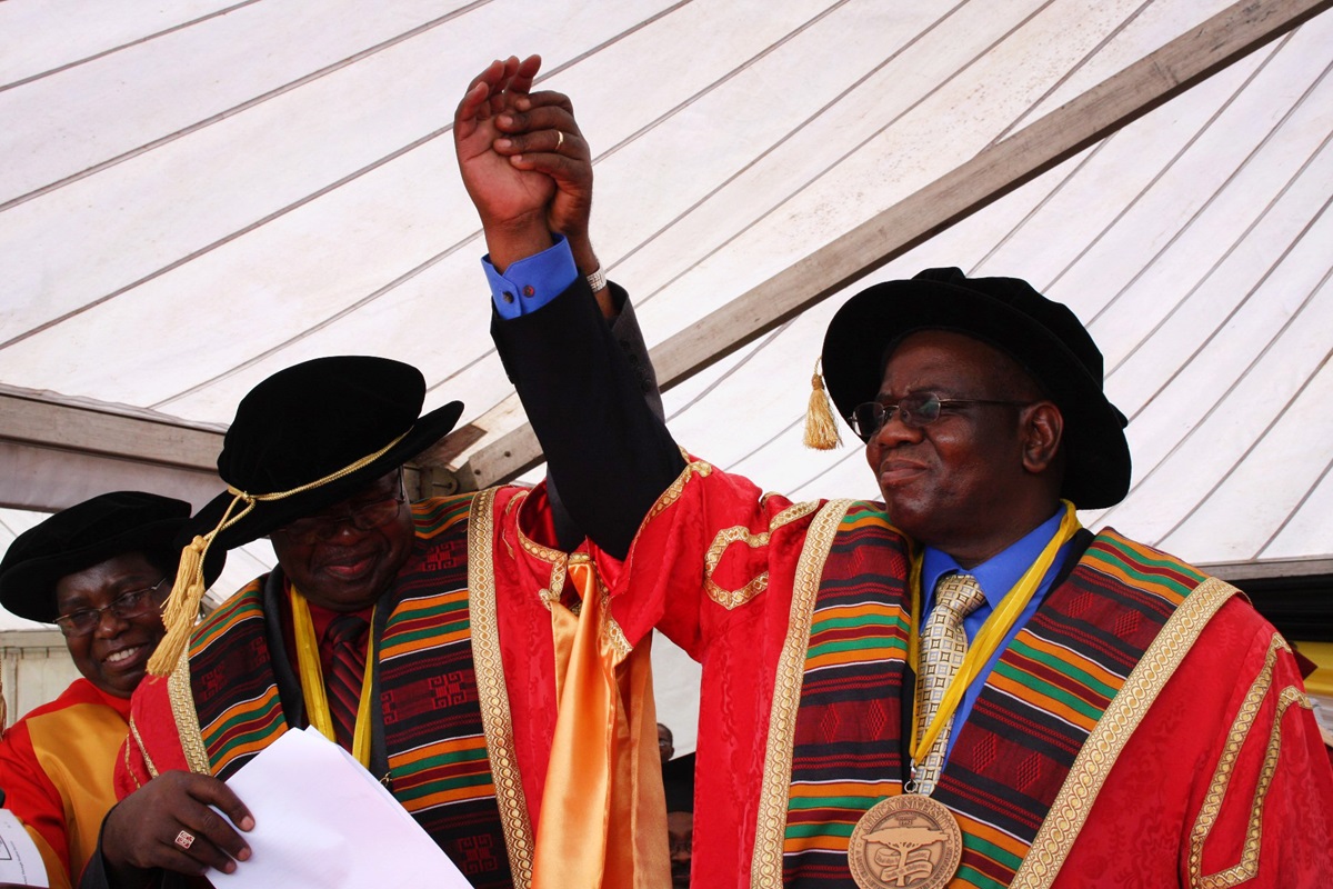 Munashe Furusa, right, receives the medallion of the Africa University vice chancellor from Bishop David Yemba, chancellor of Africa University, and the Rev. Kim Cape, top executive of the United Methodist Board of Higher Education and Ministry.  Photo by Vicki Brown, UMNS