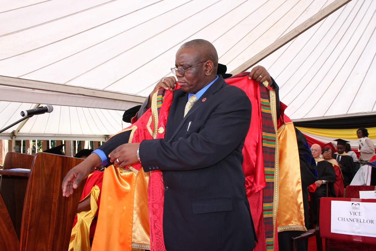 Munashe Furusa is ceremonially robed by Chancellor David Yemba, a United Methodist bishop, during Furusa's inauguration as vice chancellor of Africa University. Photo by Vicki Brown, UMNS