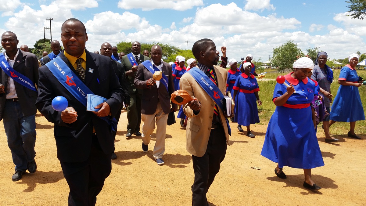 An evangelism team of almost 60 men and women praise and preach evangelism in the Mahusekwa communal area of Zimbabwe. 