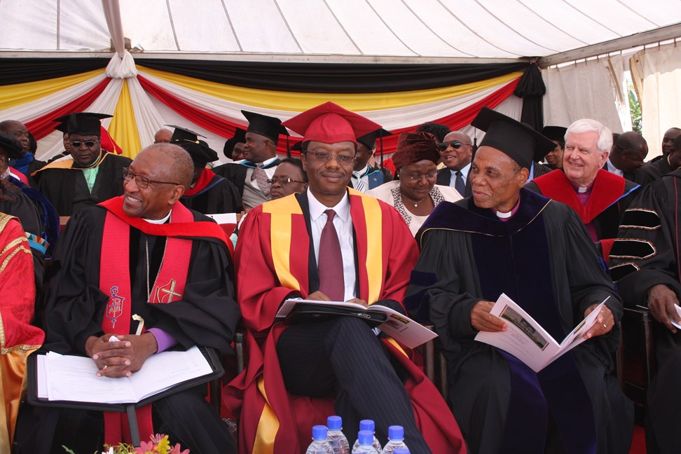 Bishop Marcus Matthews, left; Tawana Kupe, middle, who delivered the keynote address at the inauguration of Munashe Furusa as Africa University’s vice chancellor; and Bishop Eben Nhiwatiwa, right, enjoy the AU Choir. Mozambique Bishop Joaquina Nhanala is behind them, seated to the left of Rio Texas Bishop James Dorff. Photo by Vicki Brown, UMNS