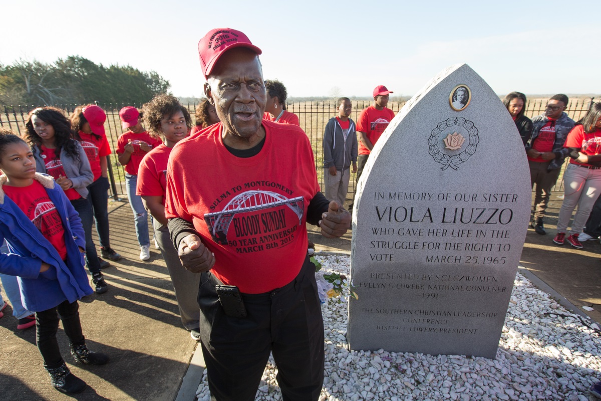Jerry Chambers, a civil rights activist and retired educator from Dallas relates the story of Viola Liuzzo to students at her memorial on U.S. Hwy. 80 near White Hall, Ala.