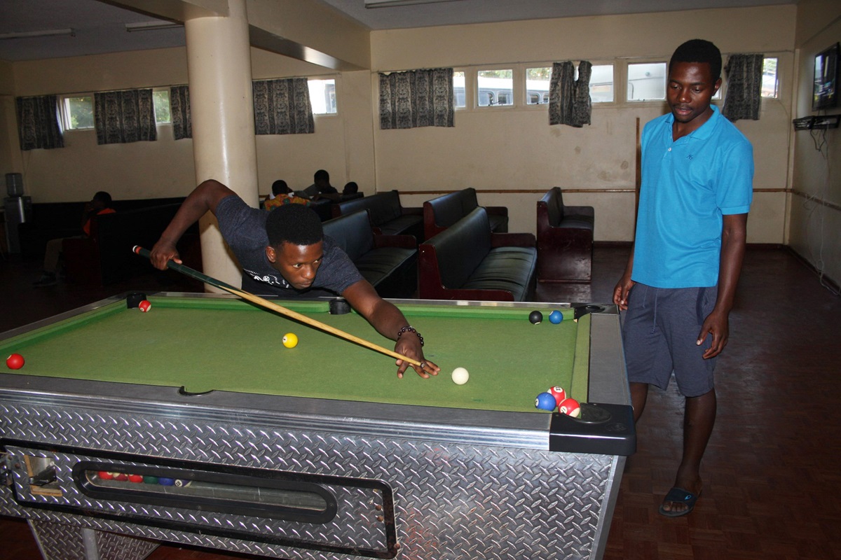 Students play pool in the media room at Africa University. Many students say more social and recreational opportunities for students are needed at the United Methodist university. Photo by Vicki Brown, UMNS