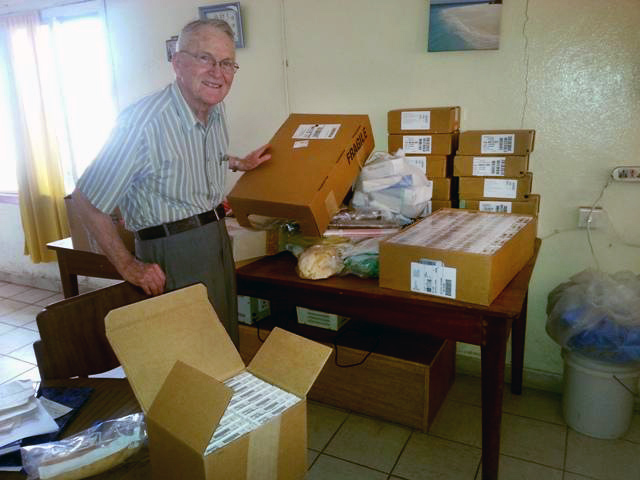 Dr. Lowell Gess unpacks some of the medicines he took to Freetown in January.