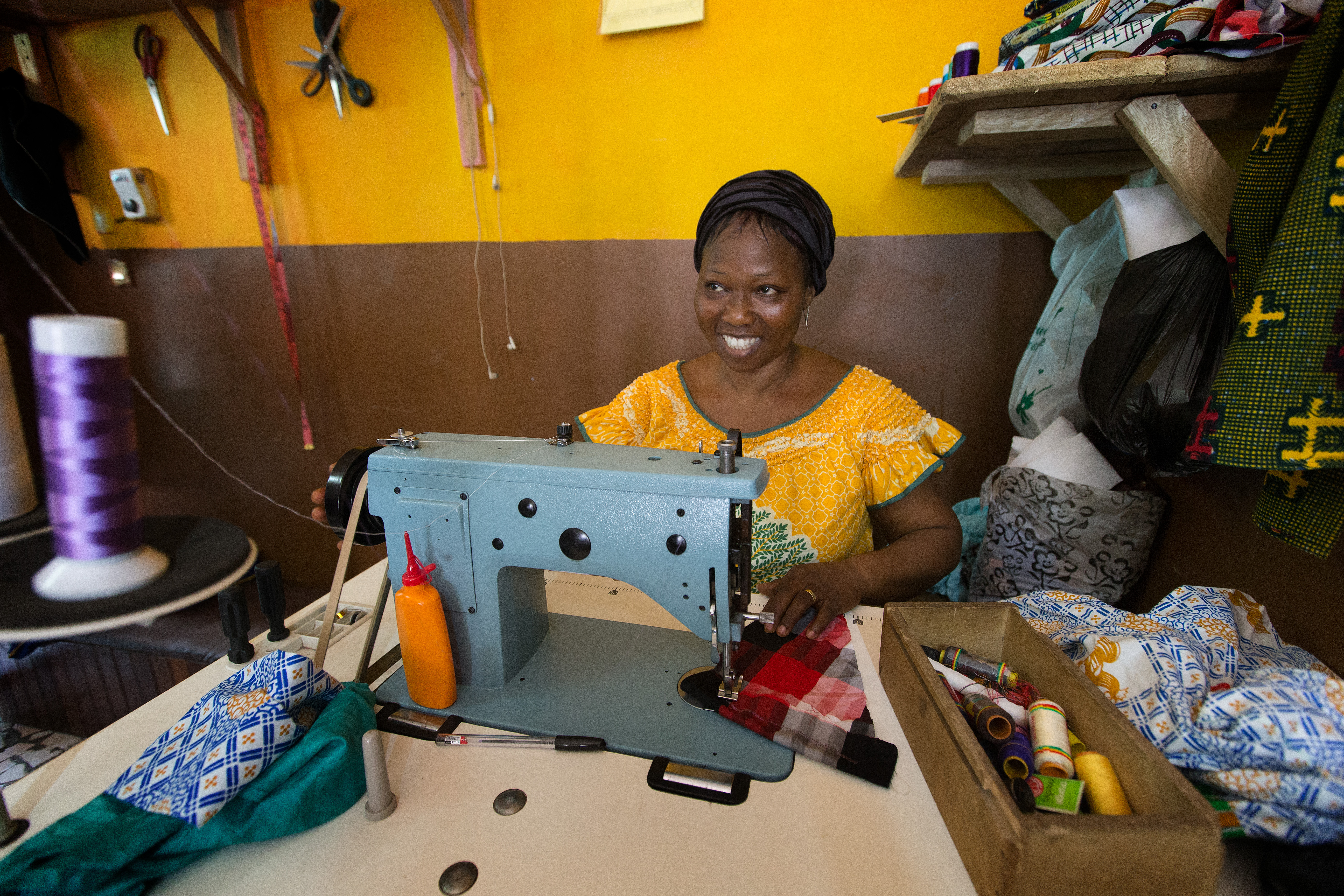 Eugenie Sowan Erse N’Ghessan sews clothes to earning a living for herself and her seven children in Abidjan, Côte d'Ivoire. 