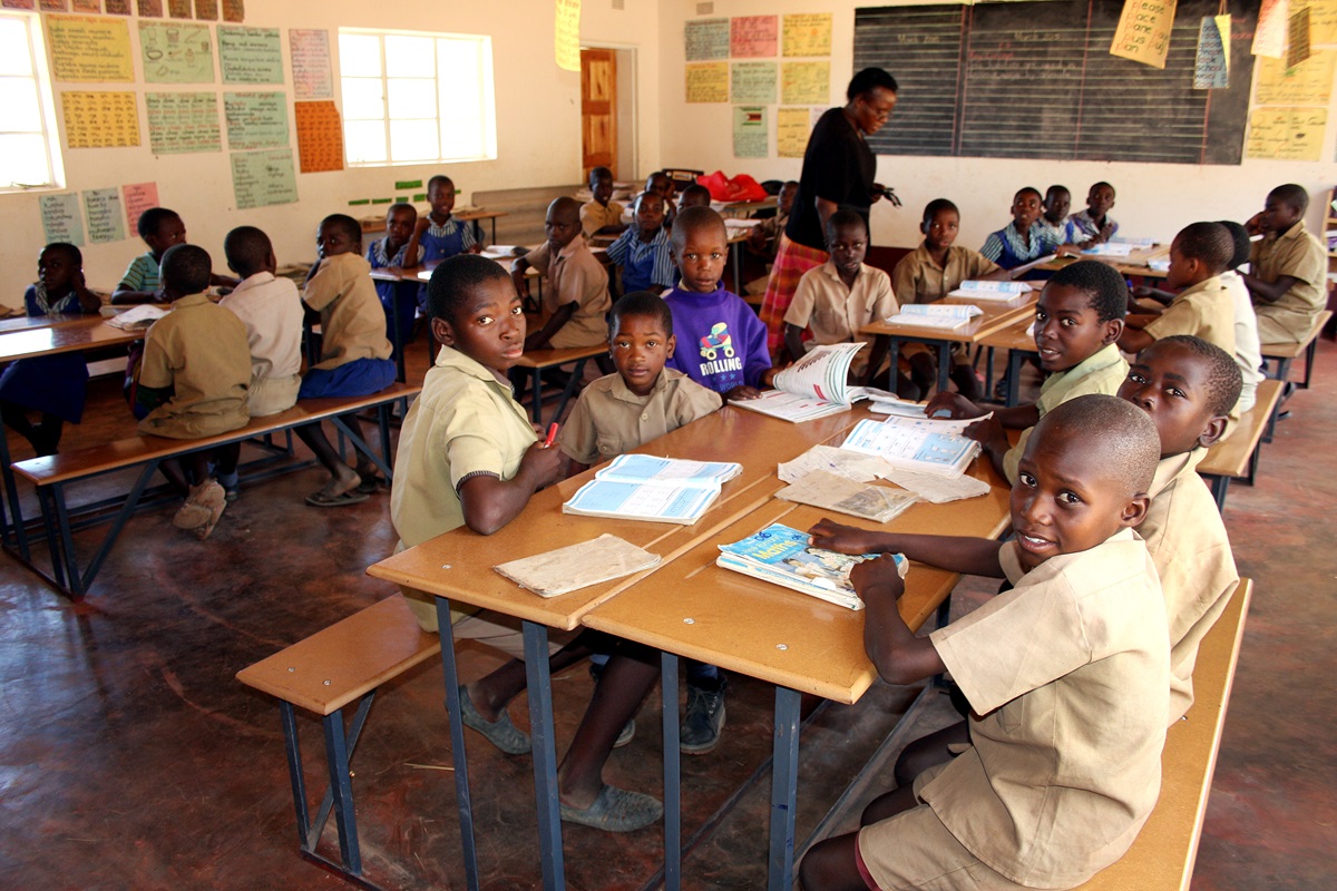 Children study in the brightly lit new classroom at the Saungweme Primary School, built with help from the Zimbabwe-Norway Partnership. Photo by Vicki Brown, UMNS