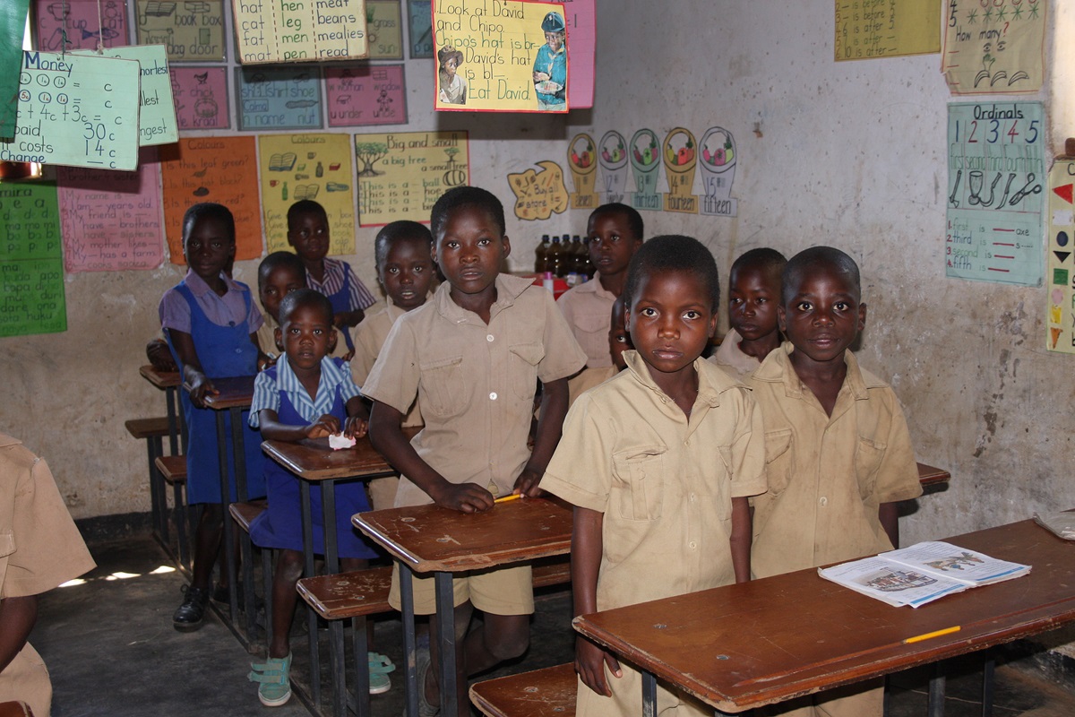 Students now studying in renovated farm buildings are looking forward to their new school. Photo by Vicki Brown, UMNS
