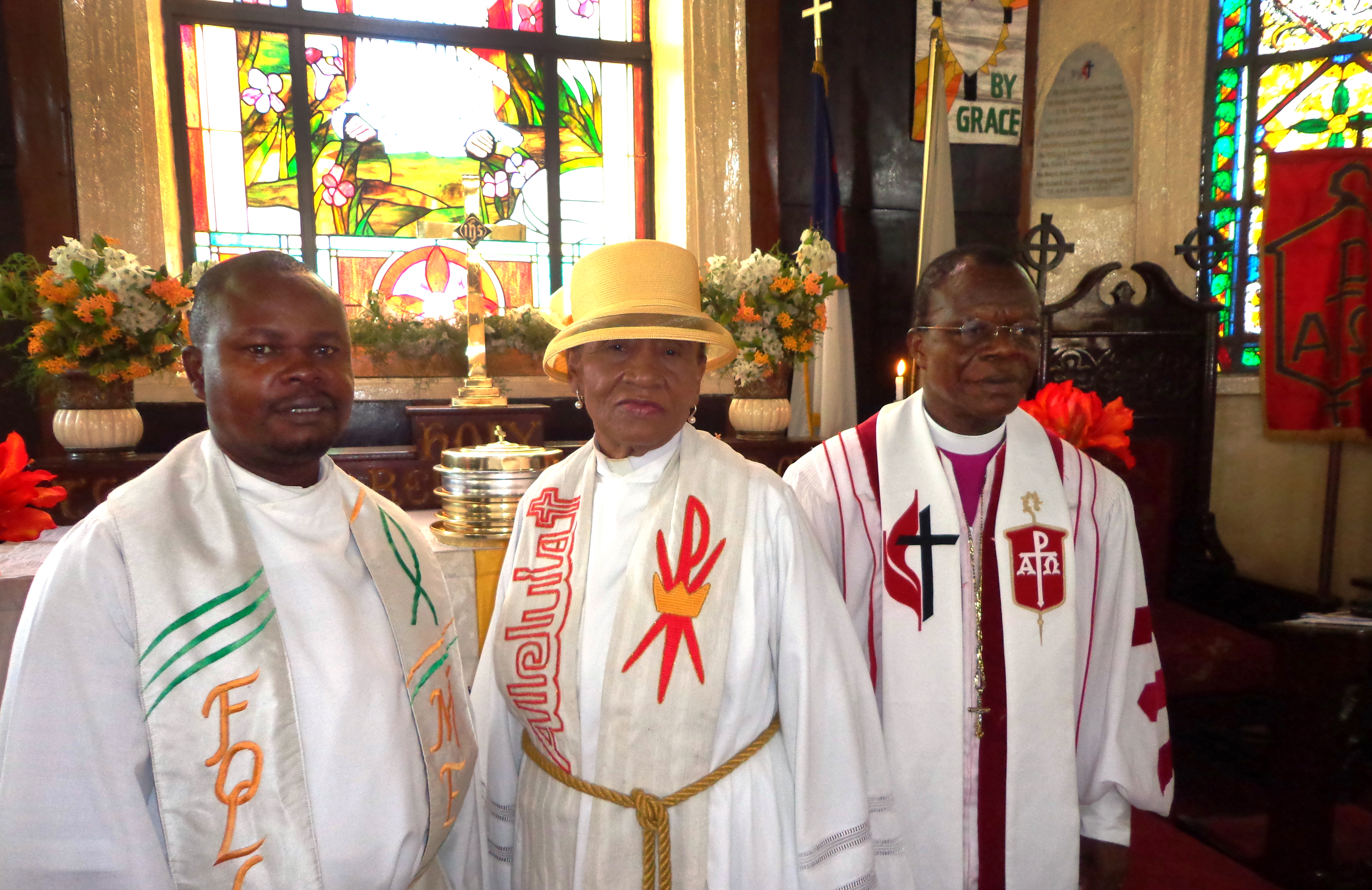 Bishop John G. Innis, right, talked about problems with the proposal to pass legislation making Liberia a Christian nation after he preached at First United Methodist Church Monrovia on Easter Sunday. Also shown are the Rev. Julius Williams, left, associate pastor of the church, and the Rev. Erlene Thompson, pastor of First United Methodist Church Monrovia. Photo by Julu Swen, UMNS