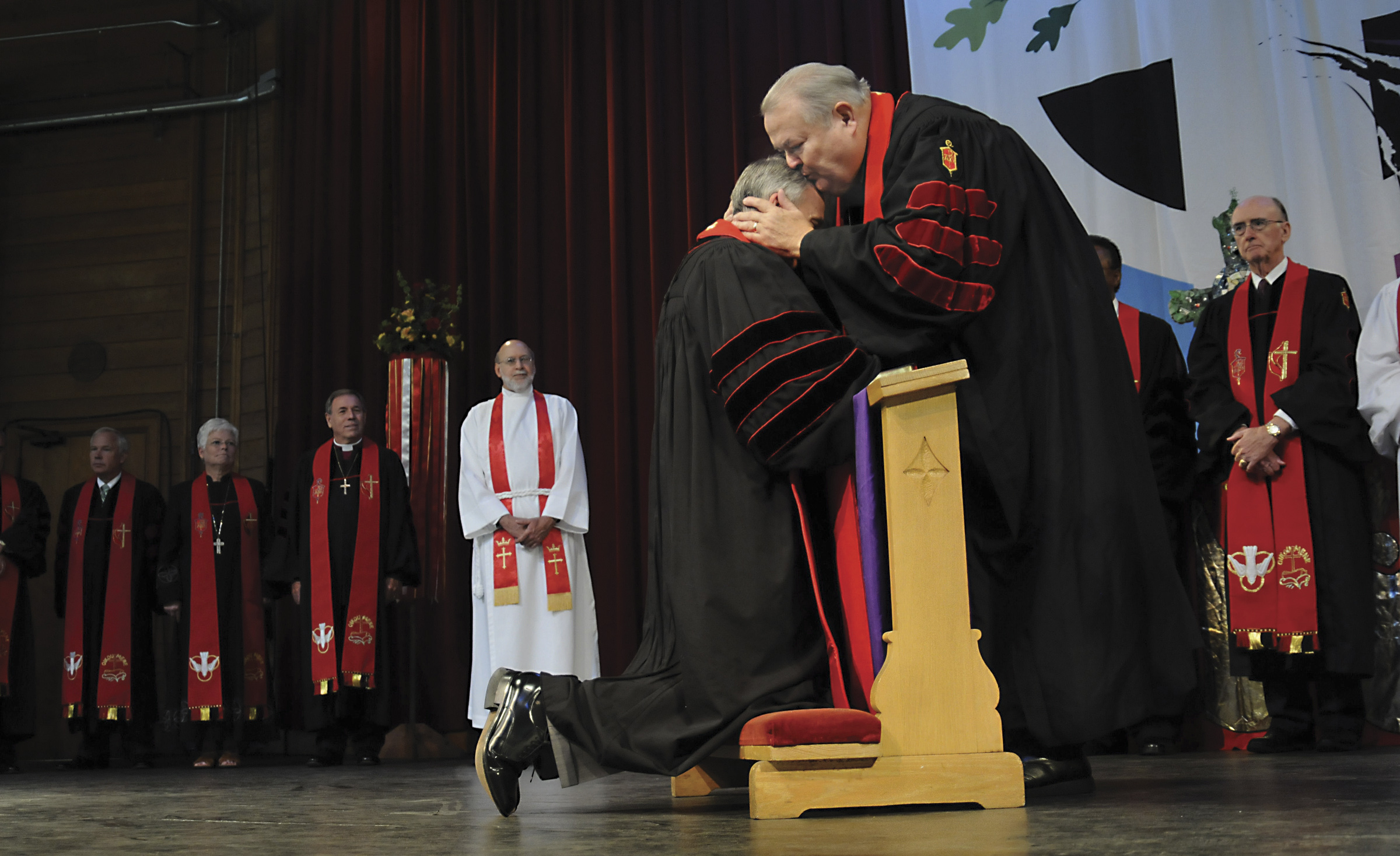 Retired United Methodist Bishop Marion Edwards kisses newly elected Bishop Paul Leeland during the Service of Consecration July 19 at Lake Junaluska, N.C. A UMNS photo By Bill Norton.