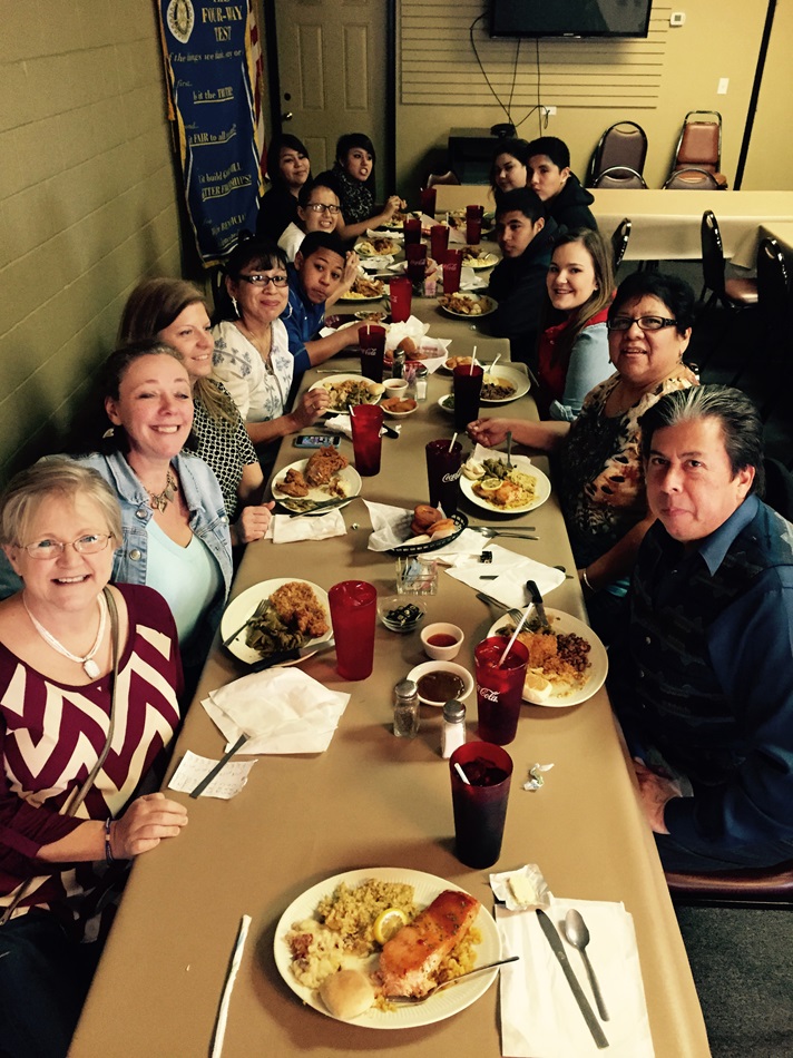 On the first day of their reunion, members of both Clinton and Providence United Methodist churches enjoy lunch after worship. Becky Yates, outreach director at Providence, is on the far left, and the Rev. David Wilson, Oklahoma Indian Missionary Conference superintendent, is on the far right. Photo by Donna Pewo