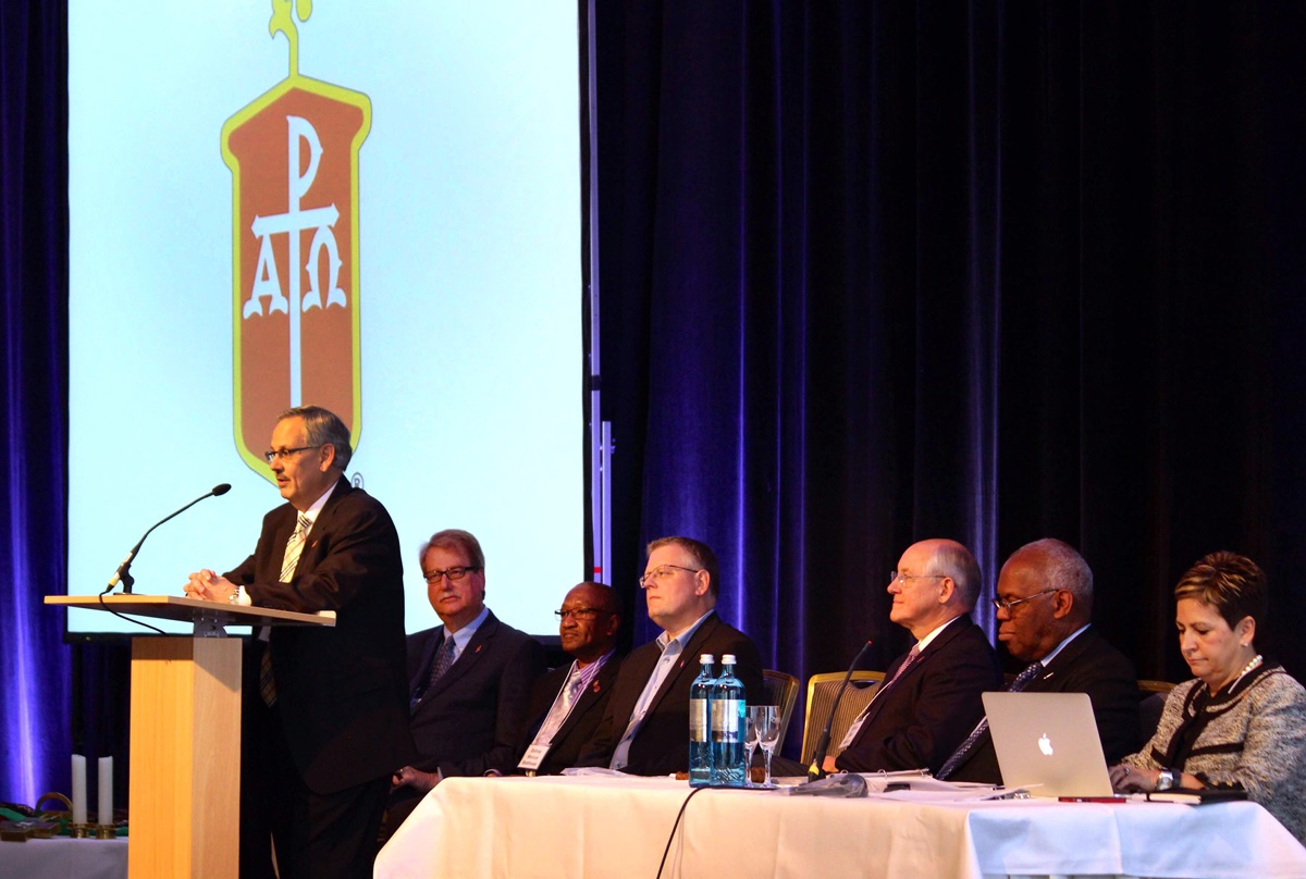 Bishop Bruce Ough speaks, as from left, Bishops Kenneth H. Carter, Marcus Matthews, Christian Alsted, Michael Watson,  Warner Brown and Cynthia Fierro Harvey listen during the May 2015 meeting in Berlin. Dakotas-Minnesota Area Bishop Ough, was elected next president of the Council of Bishops. Photo by Kay Panovec, United Methodist Communications
