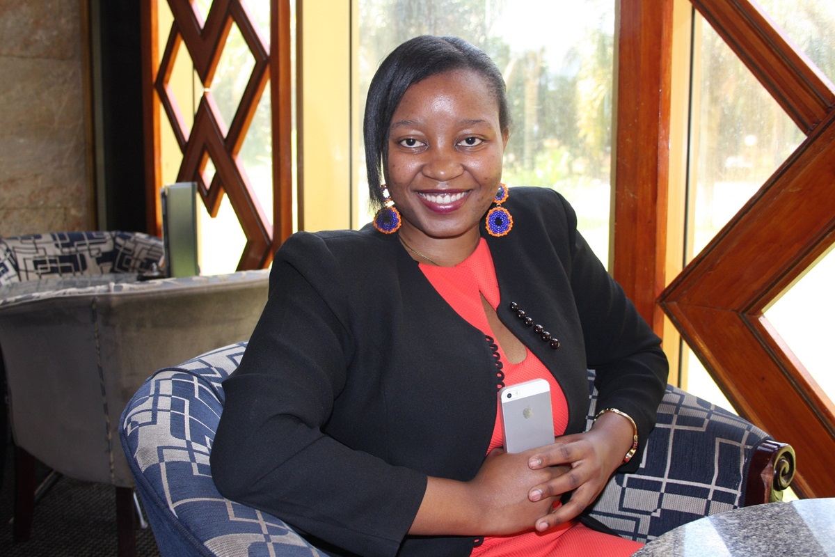 Africa University graduate Chiedza Dziva, along with six friends, is funding scholarships to help children in rural areas pay for primary school. Photo by Vicki Brown, UMNS
