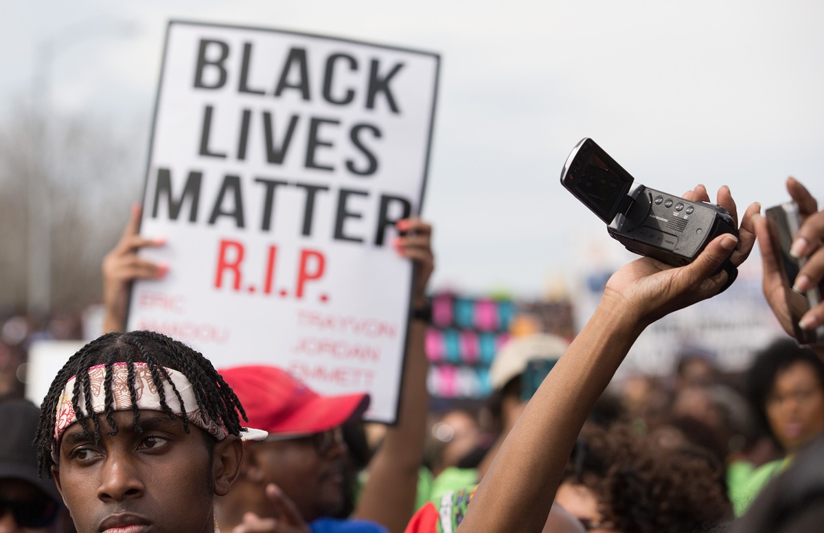 Marchers cross the Edmund Pettus Bridge in Selma, Ala., during the 50th anniversary observance of the "Bloody Sunday" protest seeking voting rights for African Americans. 