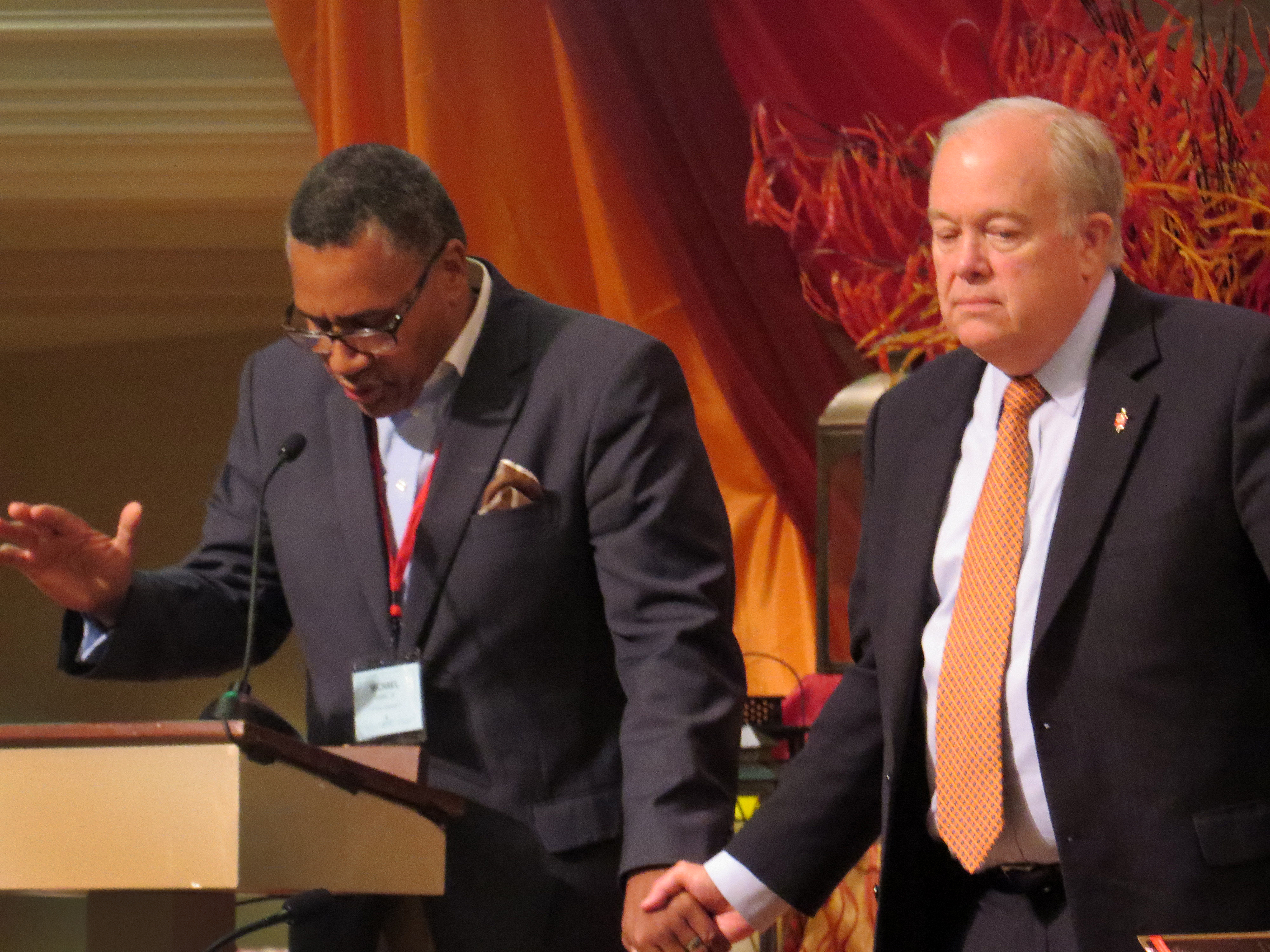 Discussion of a McKinney, Texas police officer's treatment of black youth, captured on a video that went viral, became part of the North Texas Conference annual gathering. The Rev. Michael Bowie, Jr., pastor of St. Luke Community Church in Dallas, joined hands with Bishop Michael McKee on Tuesday, June 9, while leading the conference in prayer about the incident. Photo by Sam Hodges, UMNS