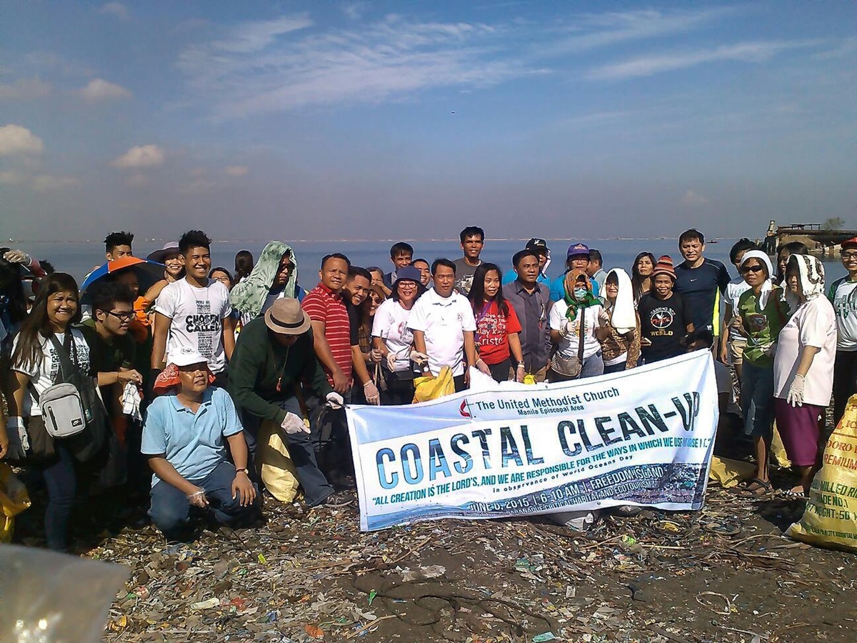 Volunteers from the United Methodist Church cleanup in observance of World Oceans Day.  The cleanup was in coordination with the Save Freedom Island Movement and other groups. Photo courtesy of Glacy Macabale