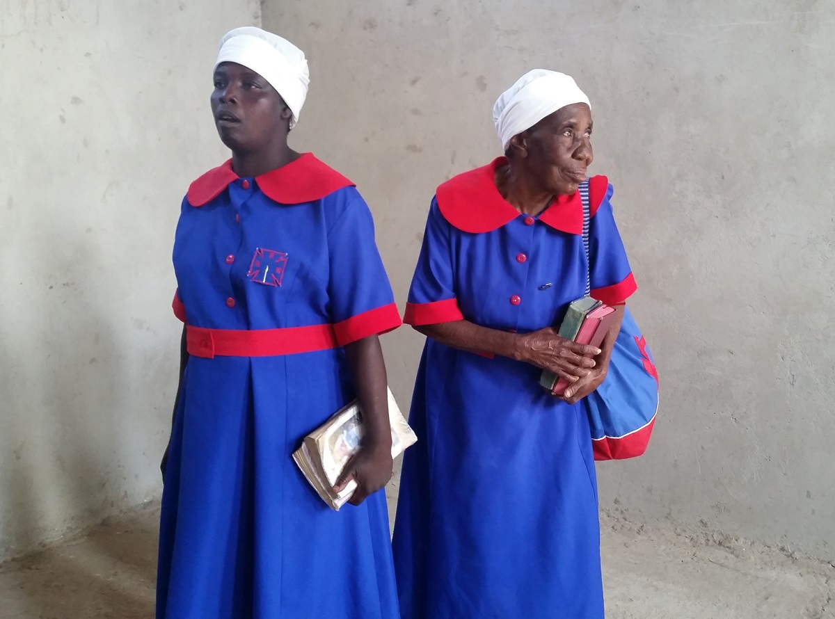 Winnet Matiza, 76, models The United Methodist Church Zimbabwe uniform with another woman at the inaugural Chitungwiza-Marondera District modeling show.  Matiza, right, was crowned “queen” at the show. Photo by Evelyn Chikwanah, UMNS