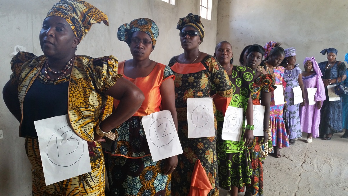 Women prepare to go on stage to model their colorful print dresses in the inaugural Chitungwiza-Marondera District modeling show. Photo by Evelyn Chikwanah, UMNS