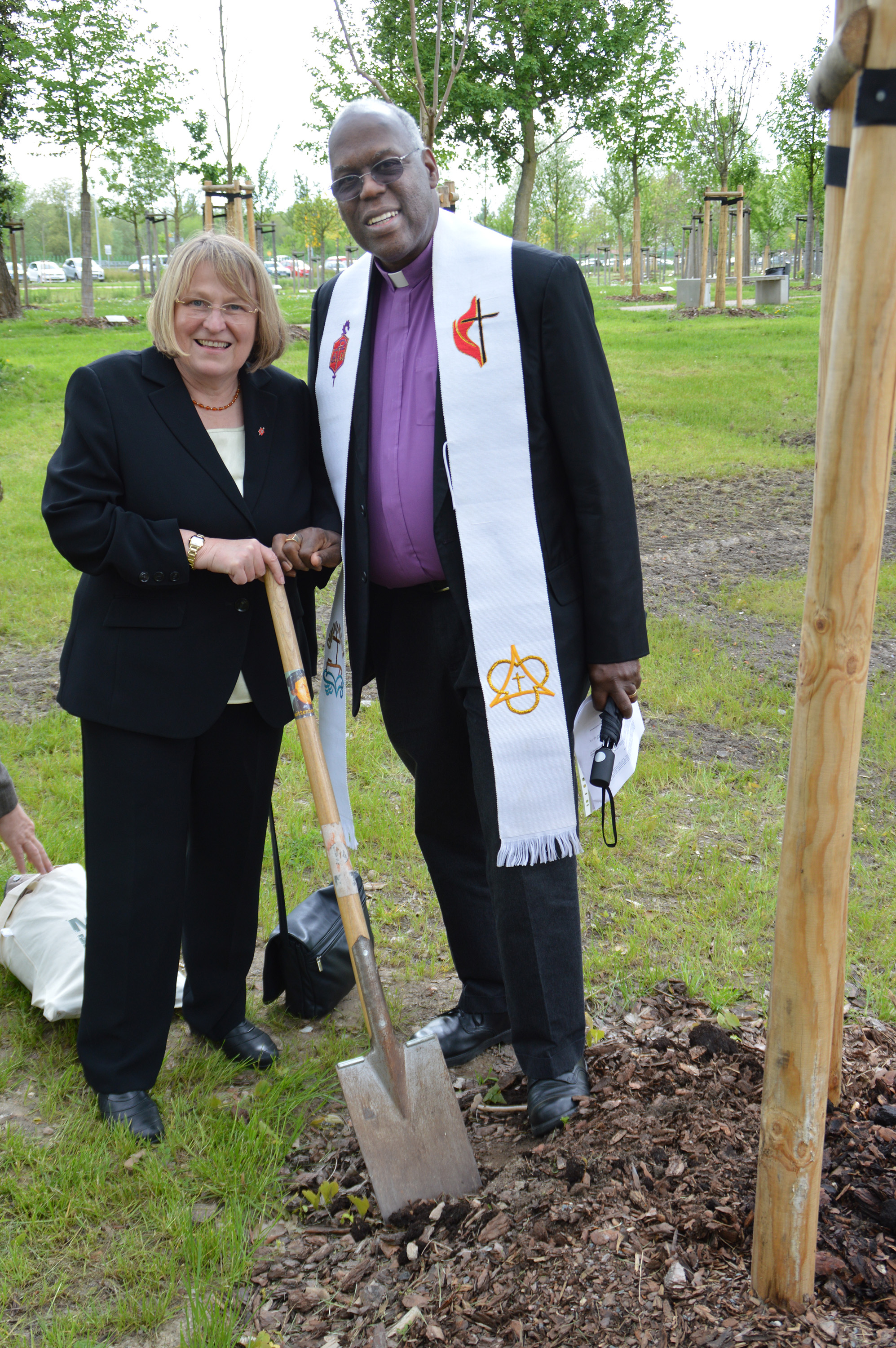 Germany Area Bishop Rosemarie Wenner and San Francisco Area Bishop Warner Brown Jr. join in a tree-planting service on May 9 in Wittenberg, Germany. Photo by Klaus Ulrich Ruof