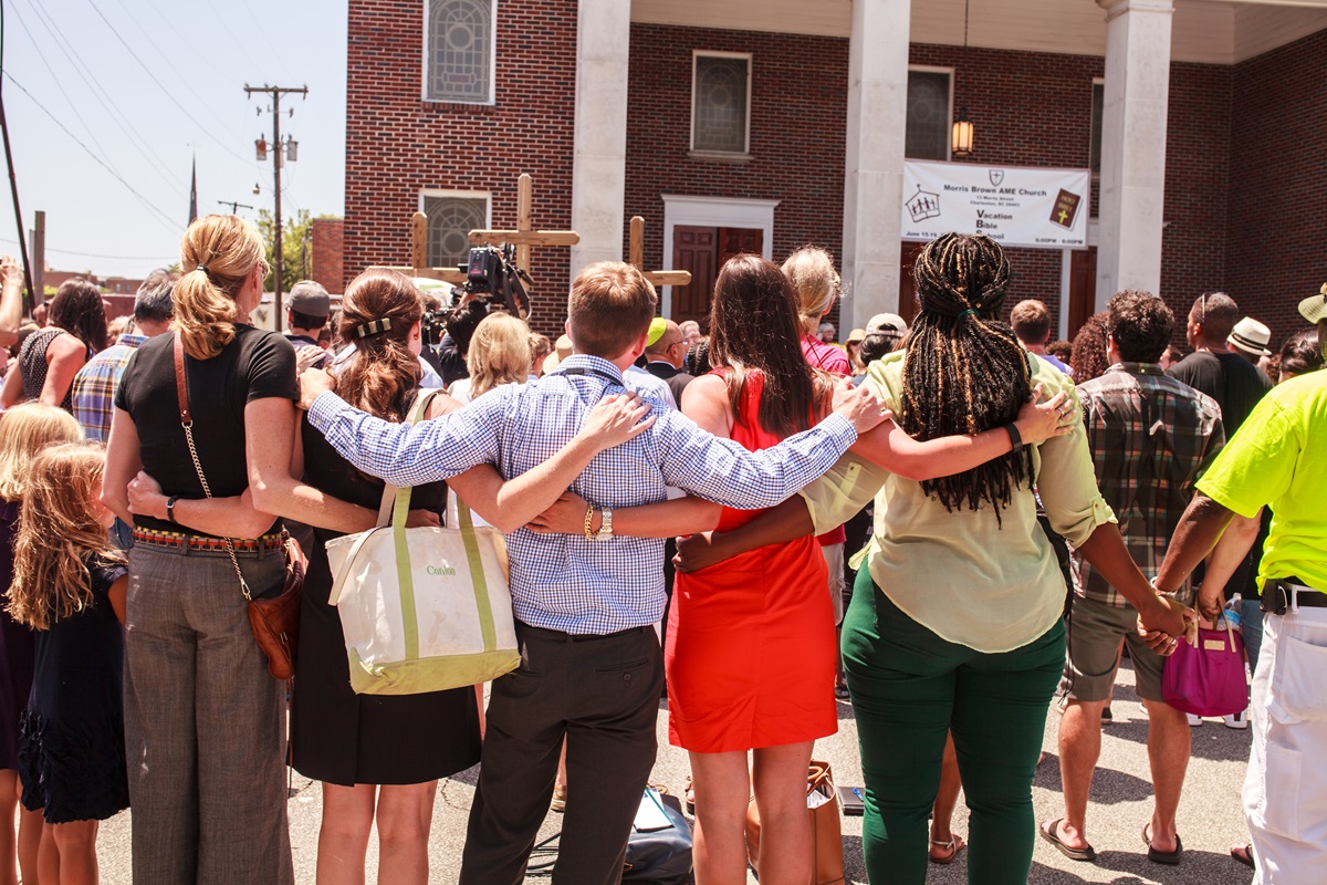 People pray outside Morris Brown African Methodist Episcopal Church in Charleston, S.C., after deadly shooting at "Mother Emanuel," the oldest AME church in the South. Photo by Lekisa Coleman-Smalls, UMNS