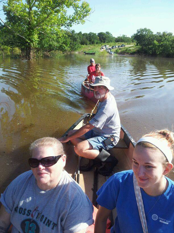 Canoes and other vessels helped get teens to Cross Point United Methodist Camp in Kingston, Okla., on Monday, June 22. Recent floods have cut off road access. Photo courtesy Cross Point Camp

