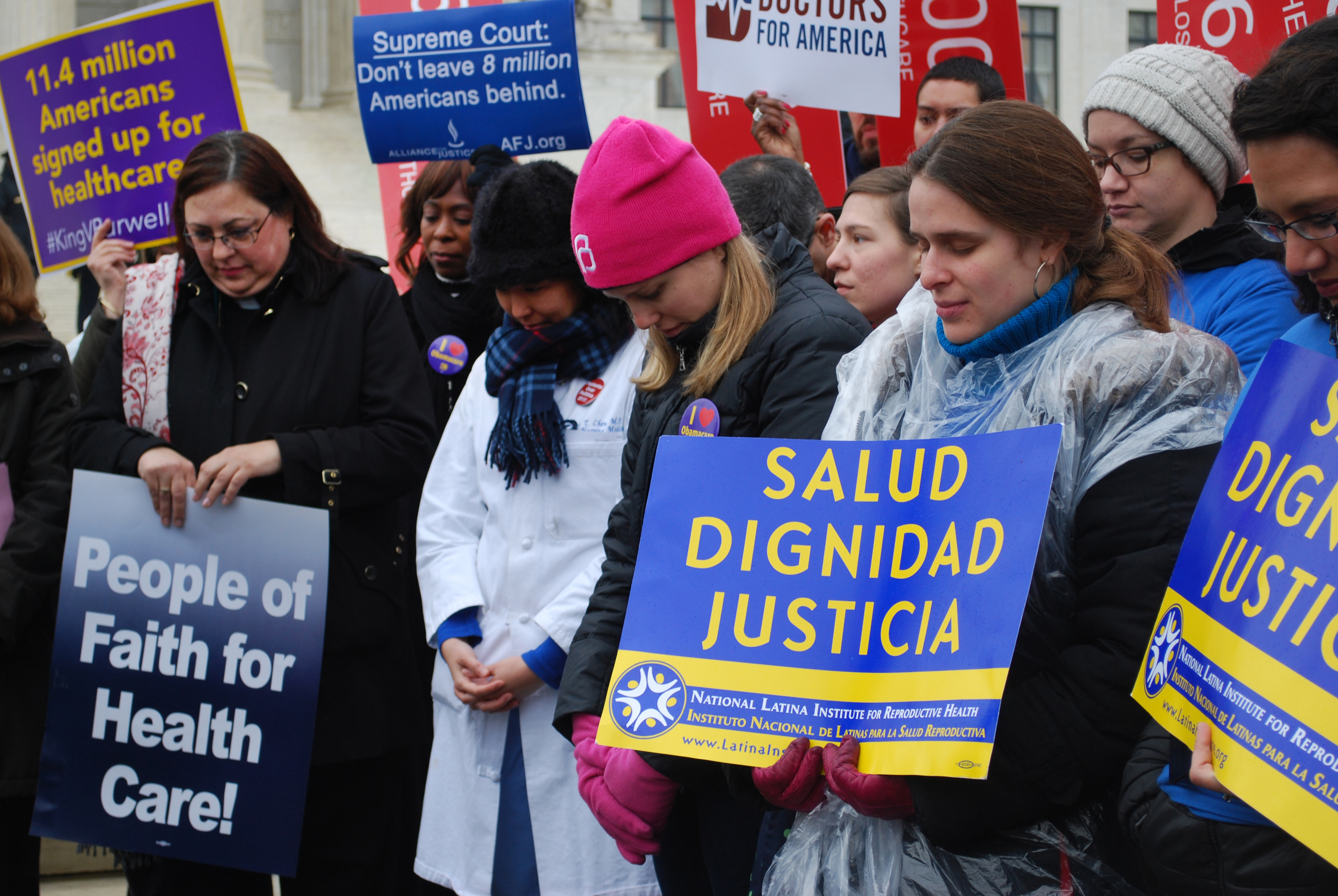 Participants pause for prayer pray during a rally at the U.S. Supreme Court regarding King vs. Burwell. Photo courtesy of United Methodist Board of Church and Society