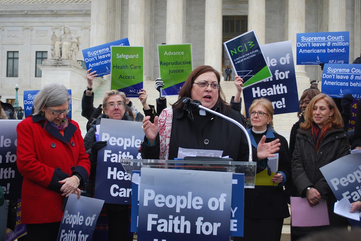 The Rev. Cynthia Abrams, director of health and wholeness at the United Methodist Board of Church and Society, speaks during a February rally for health care in front of the U.S. Supreme Court. Over Abrams' left shoulder is the Rev. Susan Henry-Crowe, top executive of the agency. A 2015 file photo courtesy of United Methodist Board of Church and Society.  