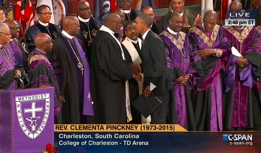 South Carolina United Methodist Bishop L. Jonathan Holston shakes hands with President Obama at the June 26 memorial service for the Rev. Clementa Pinckney, killed with eight others at Emanuel African Methodist Episcopal Church. Photo from C-SPAN livestream of service