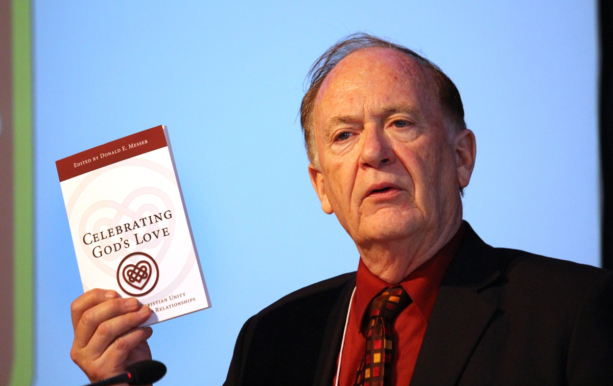 The Rev. Donald E. Messer, global consultant for the United Methodist Office of Christian Unity and Interreligious Relationships, speaks to the Council of Bishops, during its May meeting in Berlin. Messer edited “Celebrating God’s Love,” which includes essays by bishops and other United Methodists on living into Christian unity and promoting positive interreligious relationships. Photo by Kay Panovec, United Methodist Communications