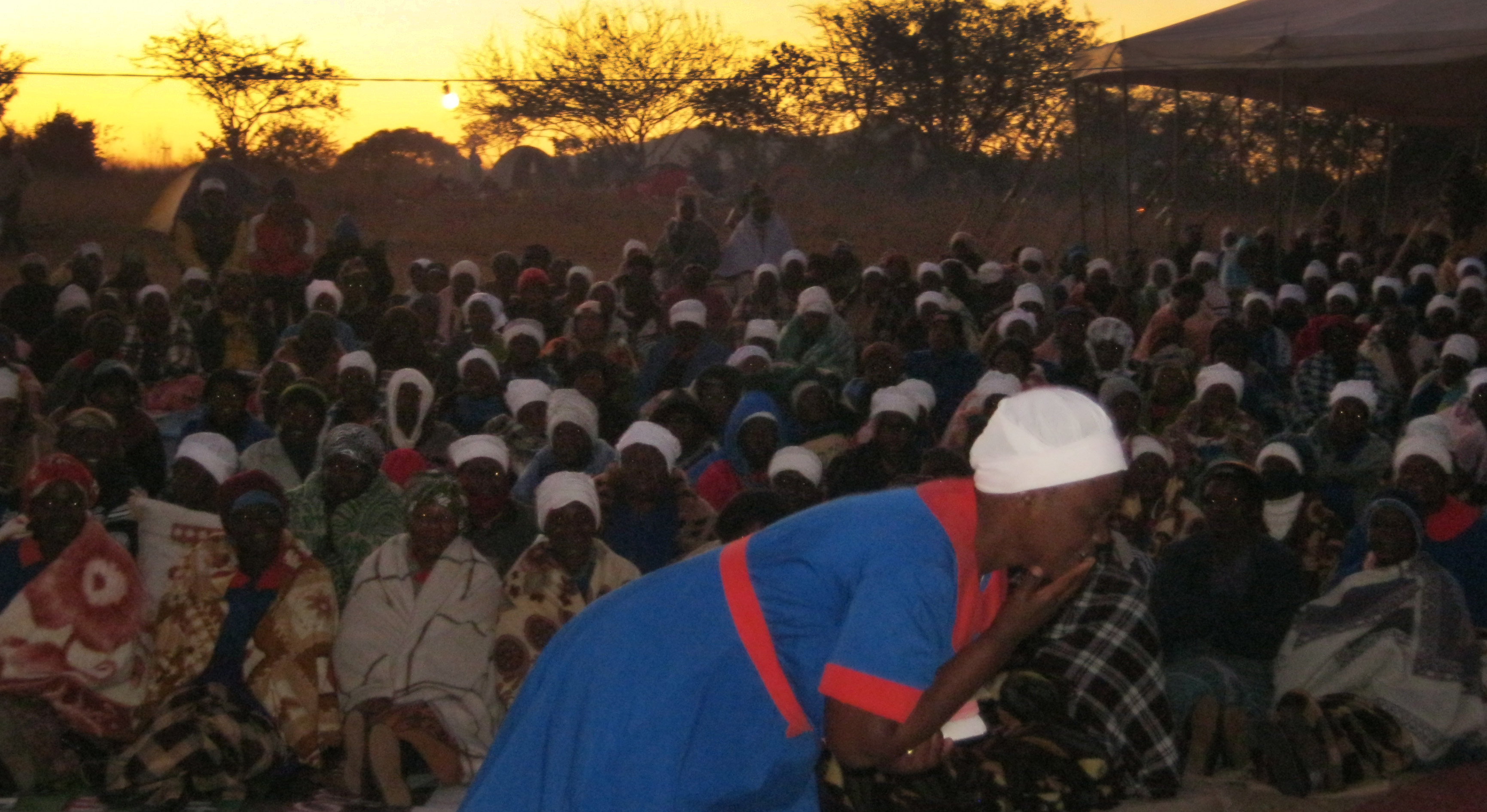 Shingirai Muranda (foreground) leads a rumuko service during a women’s union revival held at the Clare United Methodist Church campsite outside Murare in Zimbabwe. 