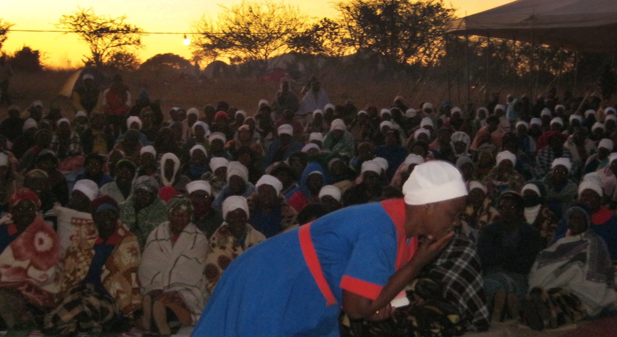 Shingirai Muranda (foreground) leads a rumuko service during a women’s union revival held at the Clare United Methodist Church campsite outside Murare in Zimbabwe. 