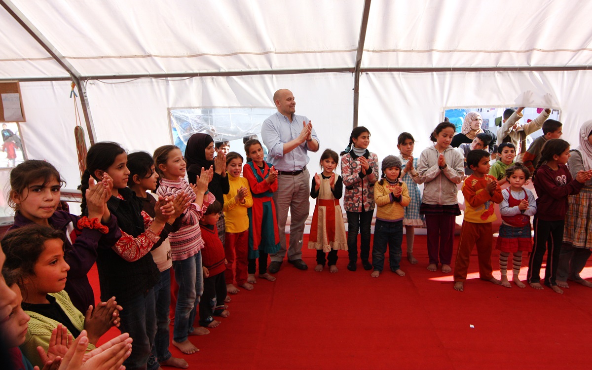 Francesco Paganini, manager of international disaster response for the United Methodist Committee on Relief, joins in an activity while visiting the UMCOR-supported child-friendly space for Syrian refugees in Turkey. Photo by James Rollins, UMCOR