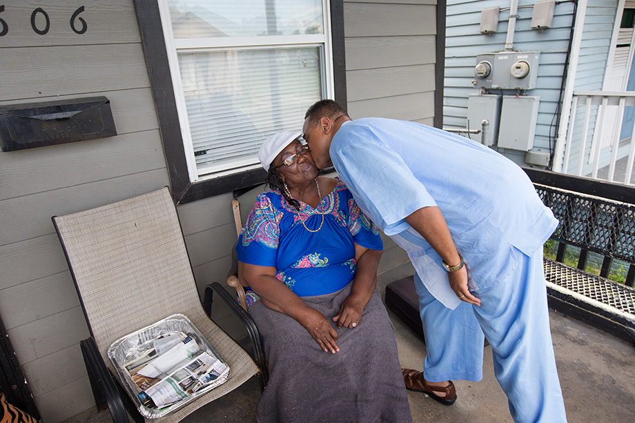 The Rev. Hadley Edwards kisses Estelle Julian during a visit to her home in New Orleans' 7th Ward. Edwards was going door to door to tell people about The Spirit Church, a new United Methodist ministry he is starting there. Edwards says Julian will be his 
