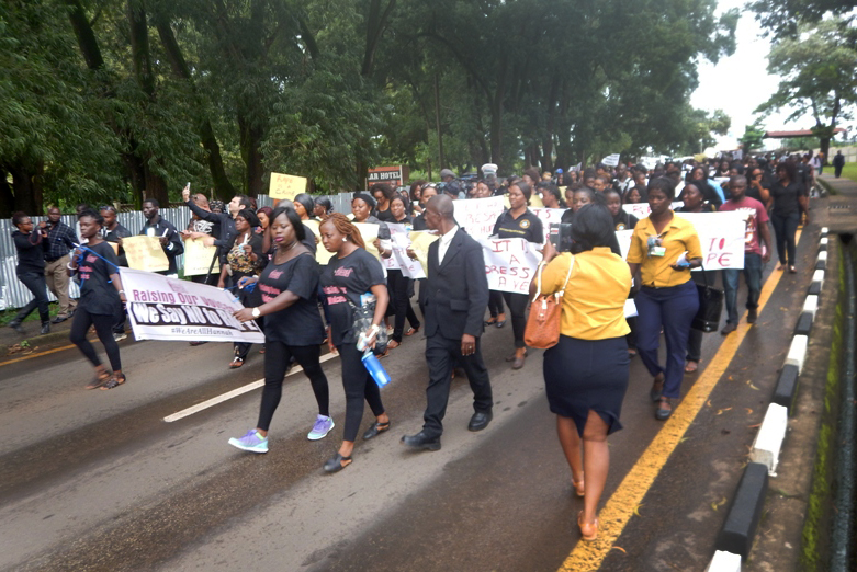 Dozens of men and women join together in the protest march against rape in Sierra Leone. United Methodist women were among the participants. Photo by Phileas Jusu, UMNS