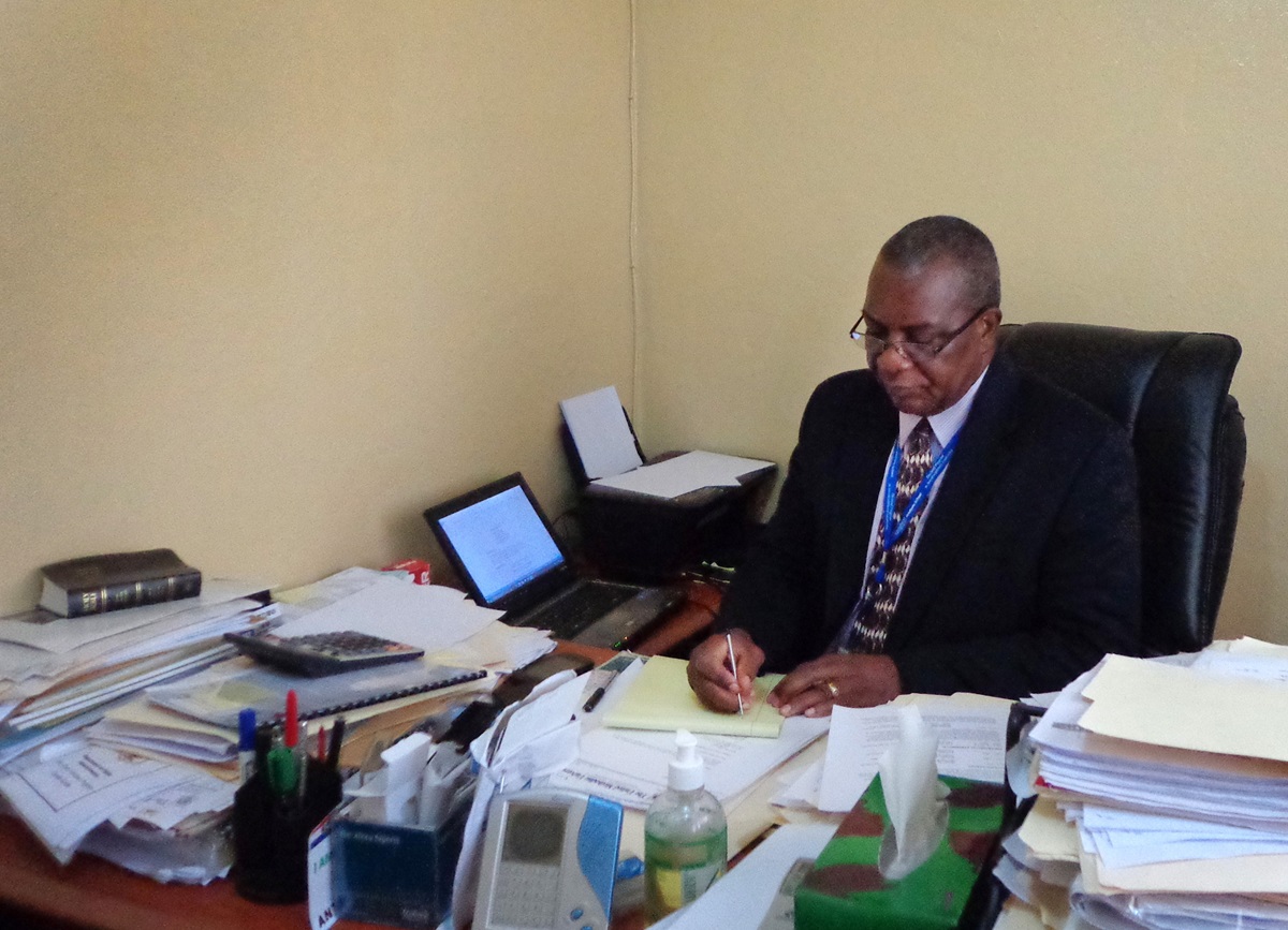 Johnson N. Gwaikolo works his office at United Methodist University in Liberia.  Gwaikolo is the new university president as appointed by Bishop John G. Innis. Photo by Julu Swen, UMNS 