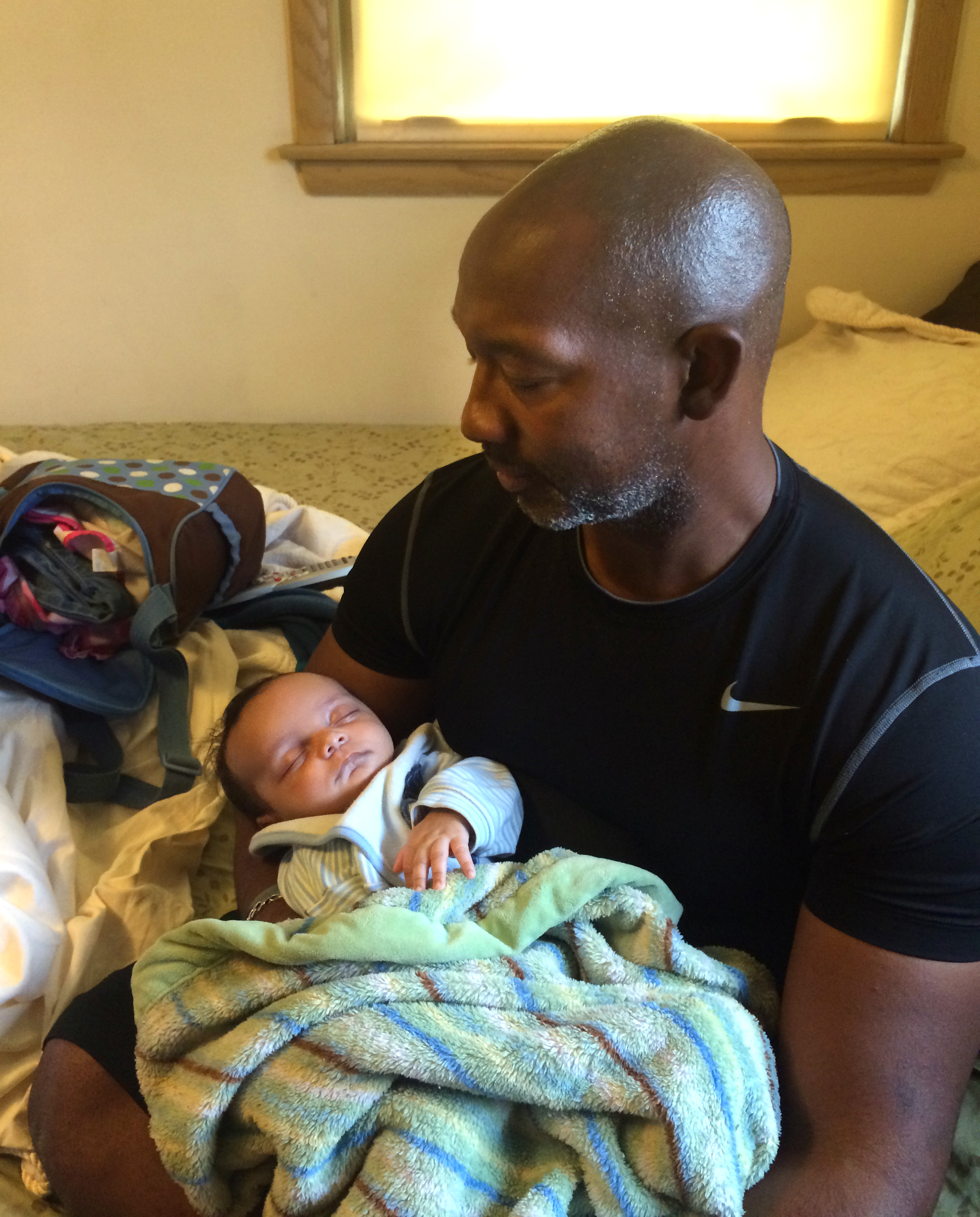 Fleurinor's husband, Terrence Moore, with baby Jaron shortly after the infant was released from a neonatal intensive care unit to their care. Moore and Fleurinor were married a year ago, shortly after Jaron and his brother Cyrus, now nearly 3, joined two other foster children in Fleurinor's care. freelance writer in Naperville, IL.  