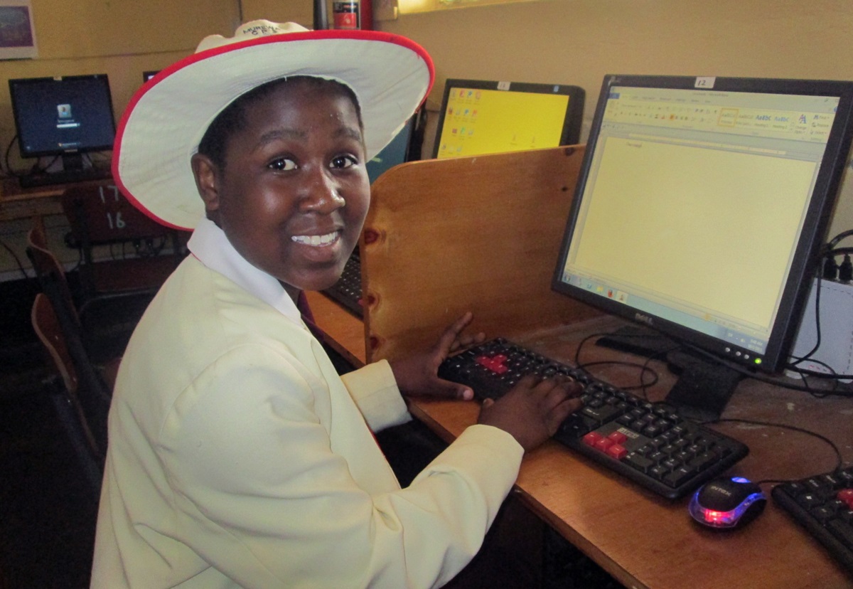 Sharon Kasiperi shows off her new computer skills at the Murewa Central Primary School.  This rural school northeast of Harare, Zimbabwe, has an enrollment of 1,585.  Photo by Taurai Emmanuel Maforo, UMNS
