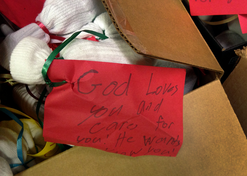 Boxes of socks and other items will be distributed to the homeless by Spring Woods United Methodist Church in Houston, where a memorial service was held for Sherry Ivy, a homeless woman found dead on the church grounds after a cold night. Photo courtesy of Paula Arnold, Texas Annual (Regional) Conference.