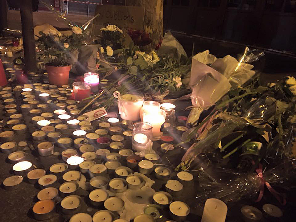 Candles and flowers were placed outside the Le Carillon café in tribute to those killed in the Nov. 13 Paris attacks. At least 129 people died in various locations and more than 350 were injured.  Photo by John Seigenthaler, Aljazeera America
