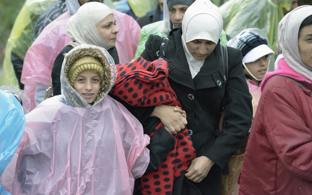At Berkasovo, Serbia, refugees from Syria and other countries cross the border into Croatia on Sept. 28, 2015. A 2015 file photo by Paul Jeffrey for the ACT Alliance