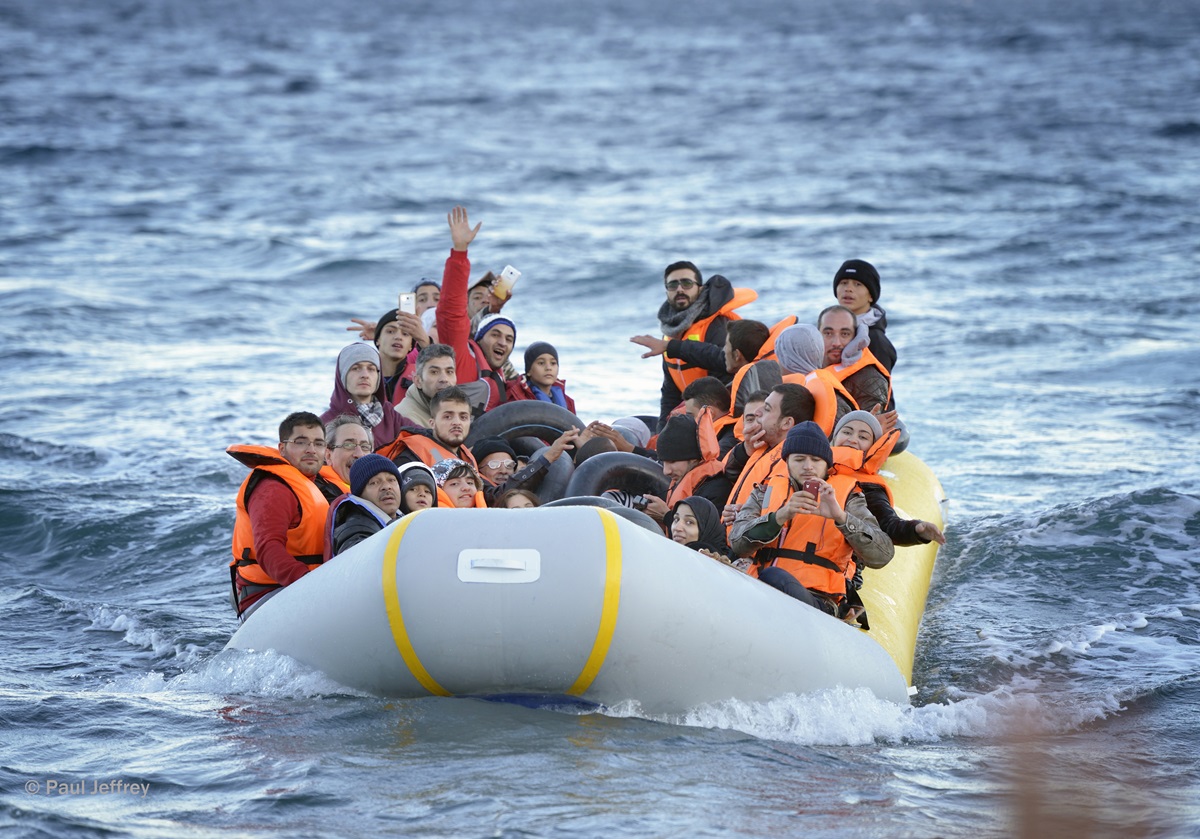 Refugees travel in a rubber boat across the Aegean Sea from Turkey to the Greek island of Lesbos on Nov. 2, 2015.  They were received on a beach near Molyvos by local and international volunteers, then proceeded on their way toward western Europe. The boat was provided by Turkish traffickers to whom the refugees paid huge sums to arrive in Greece. 